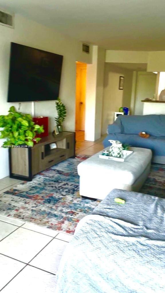 living room with tile patterned floors