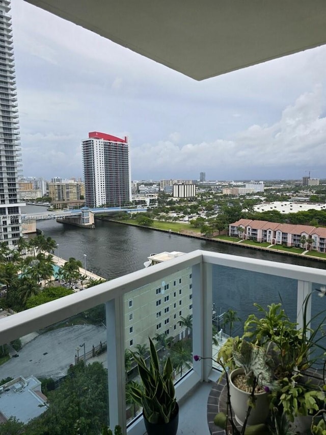 balcony featuring a water view