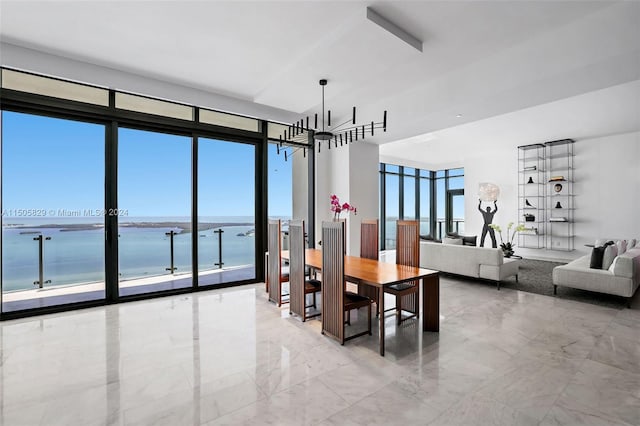 tiled dining space with a water view