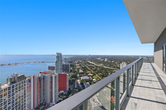 balcony featuring a water view