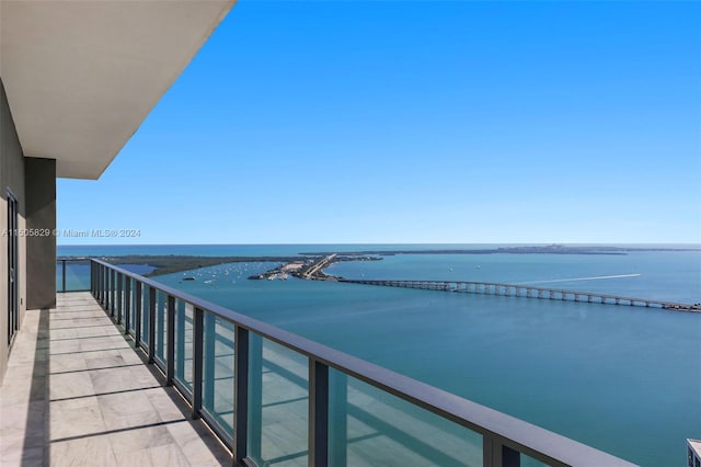 balcony featuring a water view