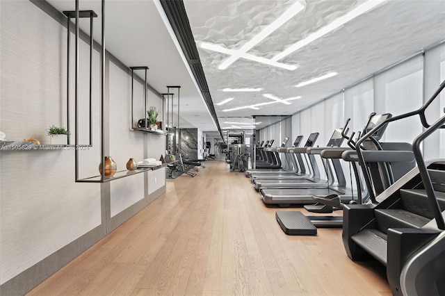 workout area with light wood-type flooring