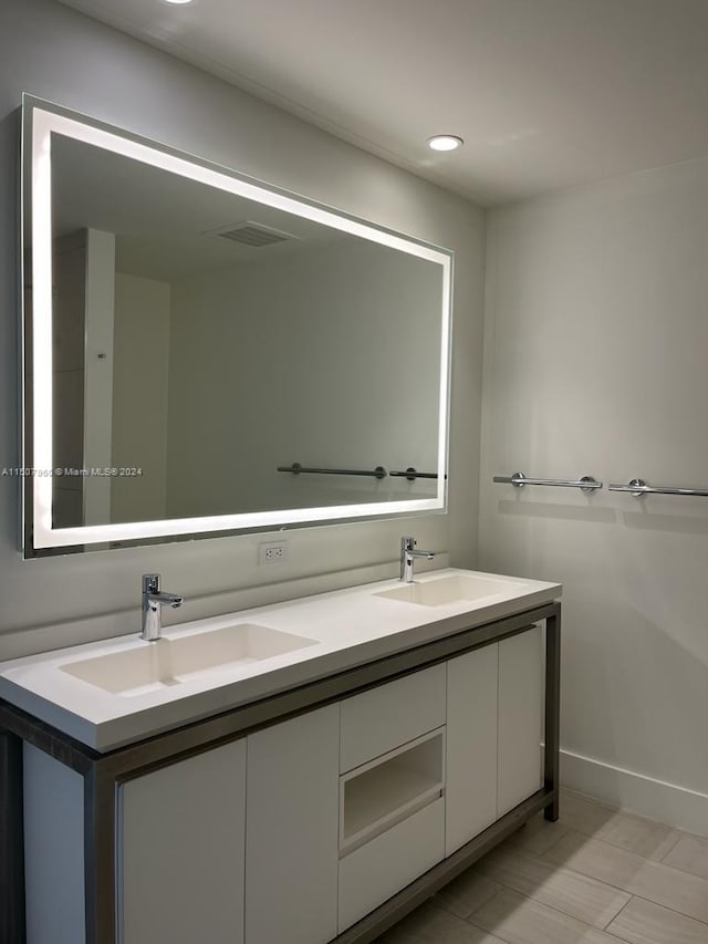 bathroom featuring dual vanity and tile patterned flooring