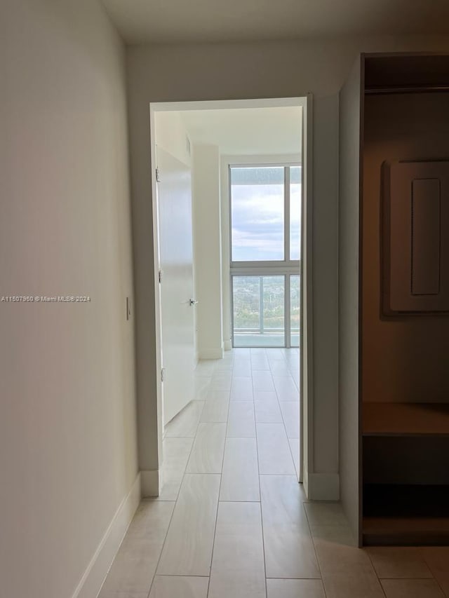 hallway with light tile patterned flooring