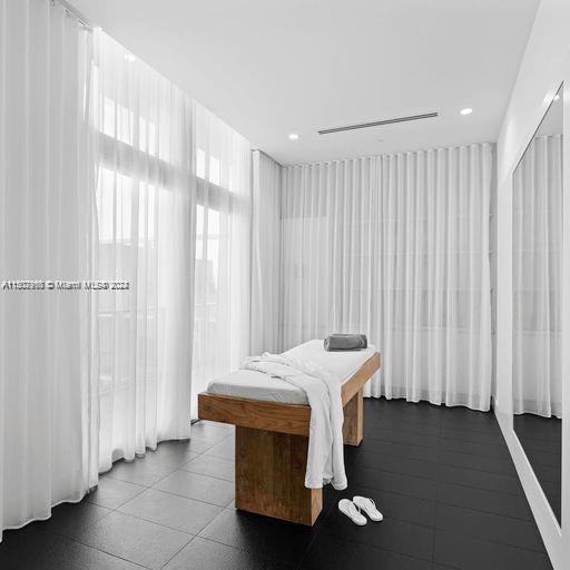 bedroom featuring tile patterned flooring