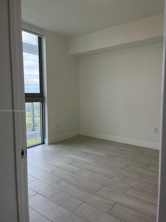 unfurnished room featuring light tile patterned floors