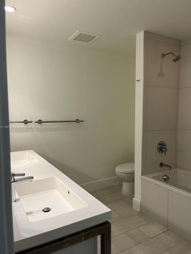 full bathroom featuring tile patterned floors, vanity, bathtub / shower combination, and toilet