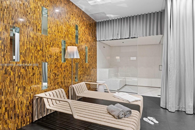 interior space featuring wood walls and tile patterned flooring