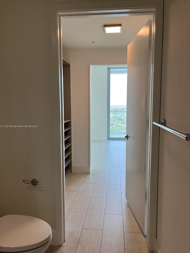 hallway with light tile patterned flooring