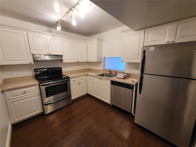 kitchen with stainless steel appliances, white cabinetry, dark hardwood / wood-style flooring, and sink