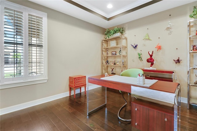 interior space featuring a raised ceiling, dark hardwood / wood-style flooring, and ornamental molding