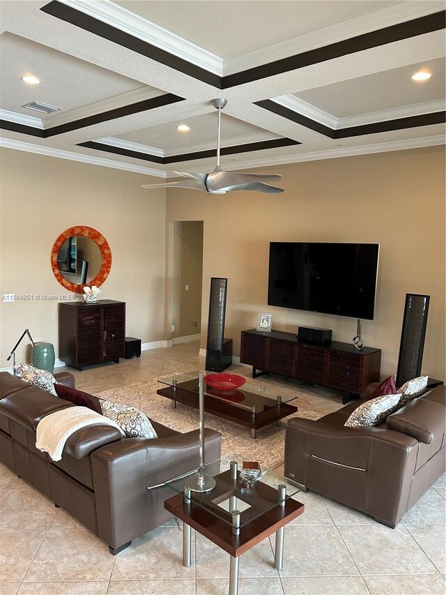 tiled living room with ceiling fan and ornamental molding