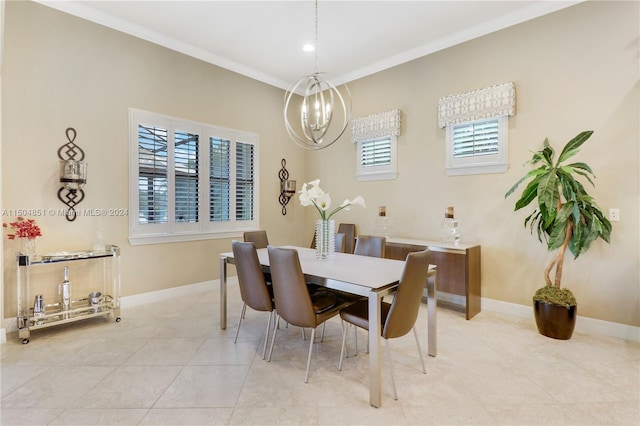 tiled dining room with a healthy amount of sunlight, a notable chandelier, and ornamental molding