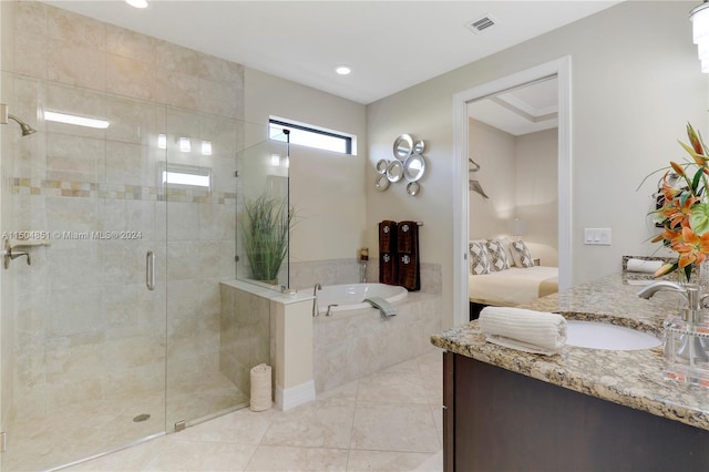 bathroom featuring tile patterned flooring, vanity, and independent shower and bath