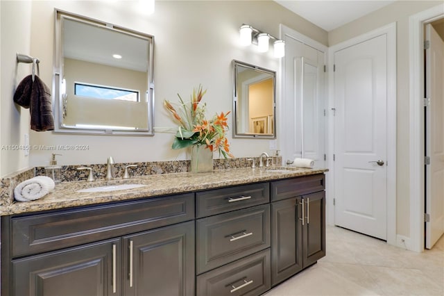 bathroom featuring tile patterned floors and vanity