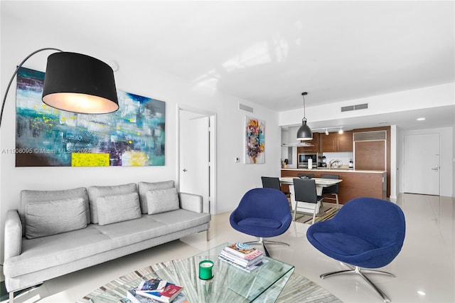 living room featuring light tile flooring