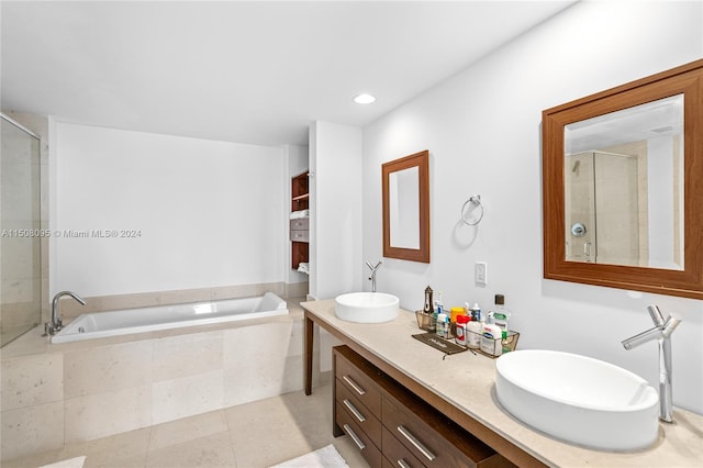 bathroom with double sink vanity, shower with separate bathtub, and tile flooring