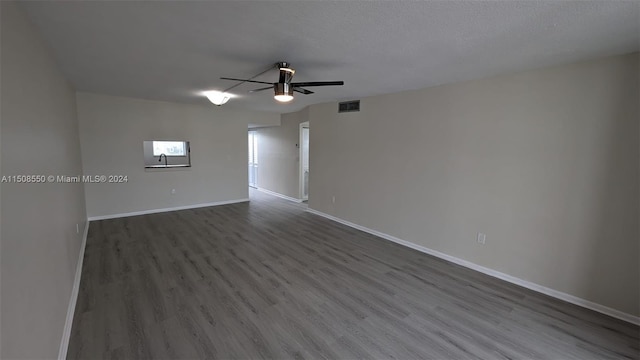 unfurnished room featuring a textured ceiling, ceiling fan, and hardwood / wood-style flooring