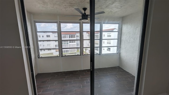 unfurnished room with ceiling fan