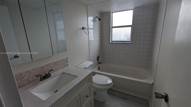 full bathroom with toilet, vanity, tiled shower / bath, and wood-type flooring