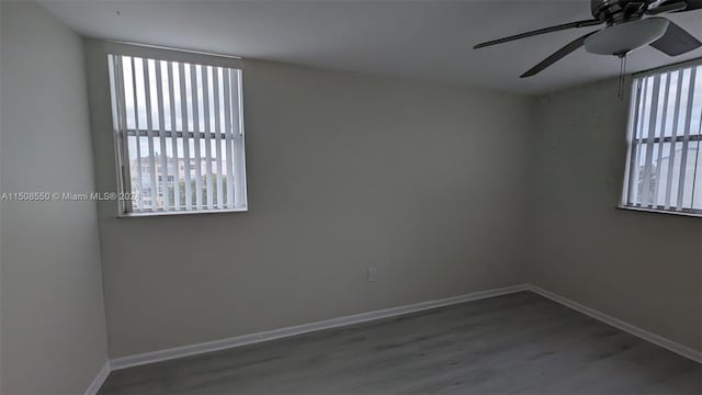 empty room featuring hardwood / wood-style floors and ceiling fan