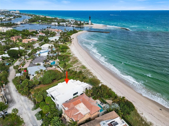 aerial view with a view of the beach and a water view