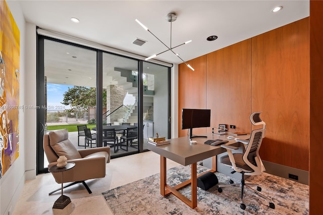 office area featuring a wall of windows and an inviting chandelier