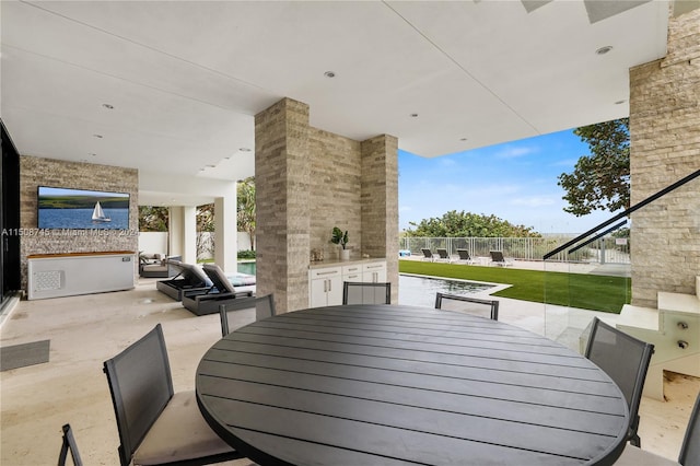 exterior space featuring area for grilling and outdoor lounge area