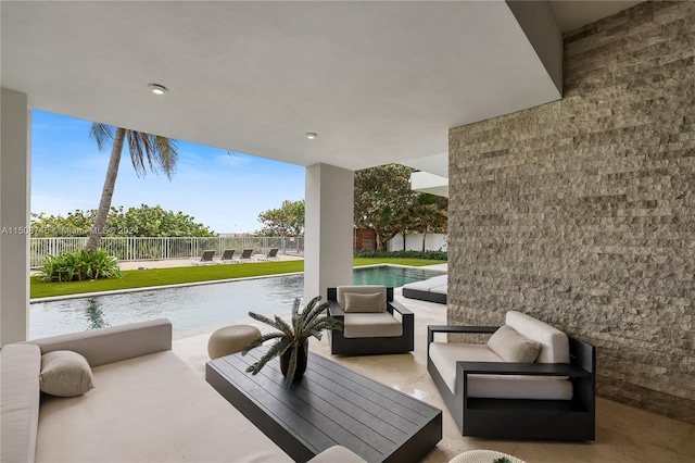 view of patio featuring an outdoor living space and a water view