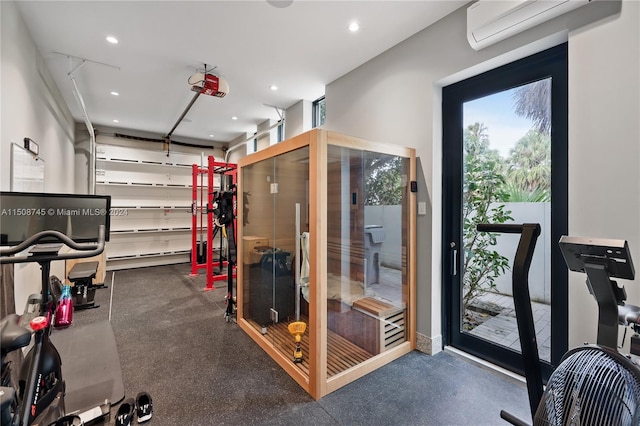 exercise area featuring a wall unit AC