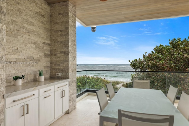 balcony with a view of the beach and a water view