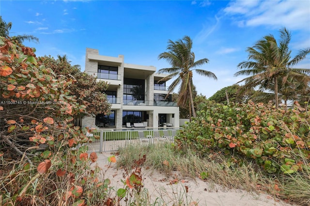 back of property featuring a balcony