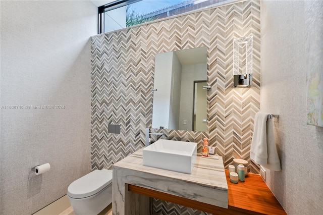 bathroom featuring toilet and vanity