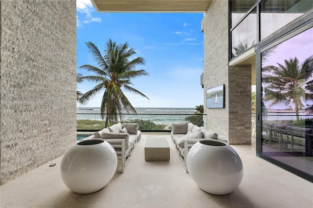 view of patio with an outdoor hangout area and a water view