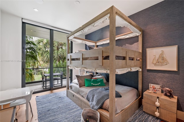 bedroom featuring expansive windows