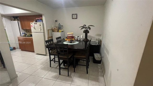 dining area featuring light tile patterned floors