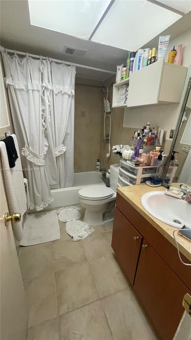 full bathroom featuring vanity, shower / bath combination with curtain, and toilet