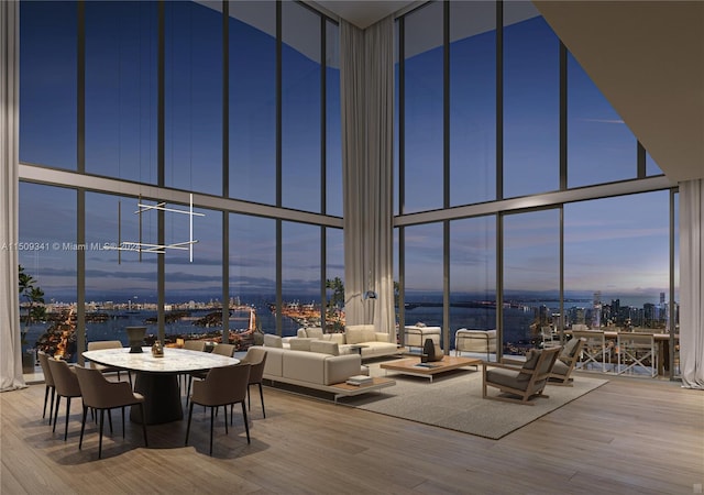 unfurnished dining area with hardwood / wood-style flooring and expansive windows