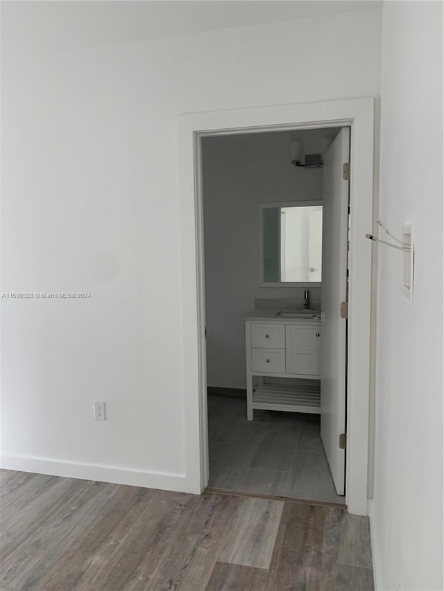 hall featuring sink and hardwood / wood-style flooring