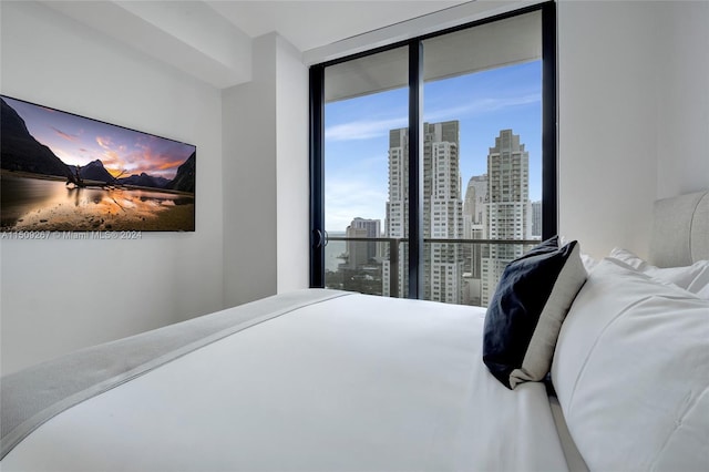 bedroom featuring expansive windows