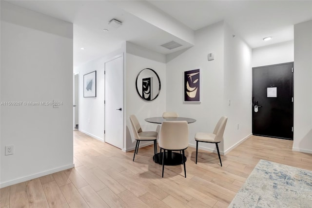 dining area with light hardwood / wood-style flooring