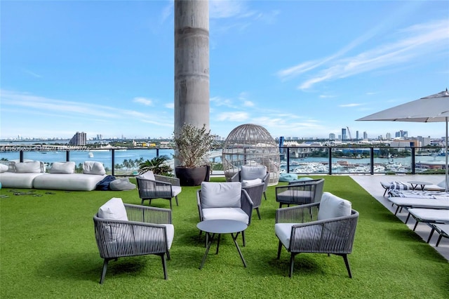 view of patio with a water view and an outdoor hangout area