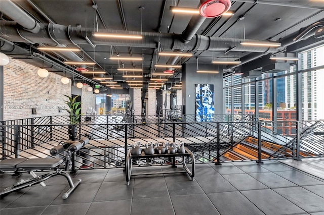 exercise room with brick wall