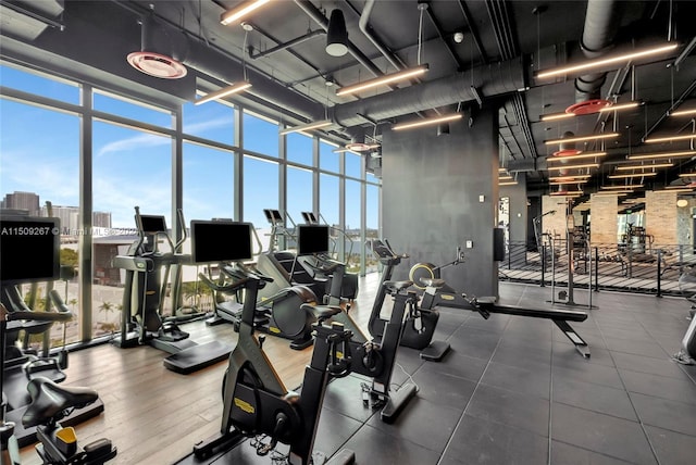 workout area featuring floor to ceiling windows