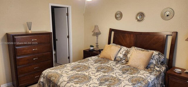 tiled bedroom with multiple windows