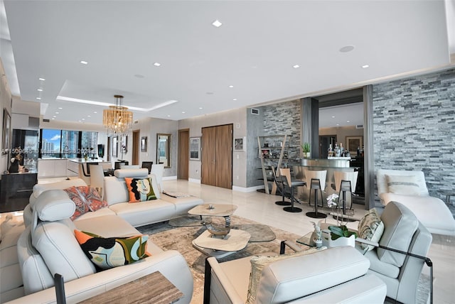 living room featuring a notable chandelier and light tile floors