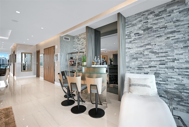 dining area featuring light tile floors