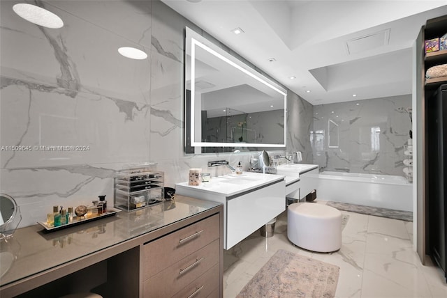 bathroom featuring tile walls, tile floors, tiled shower / bath combo, and dual vanity