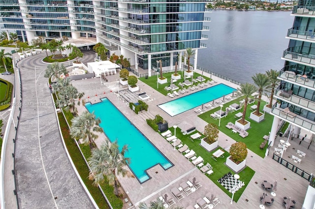 birds eye view of property with a water view