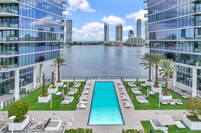 view of swimming pool with a water view